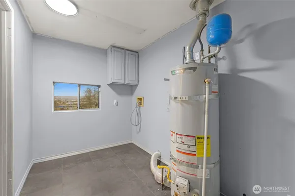 a view of storage and utility room with racks on the wall