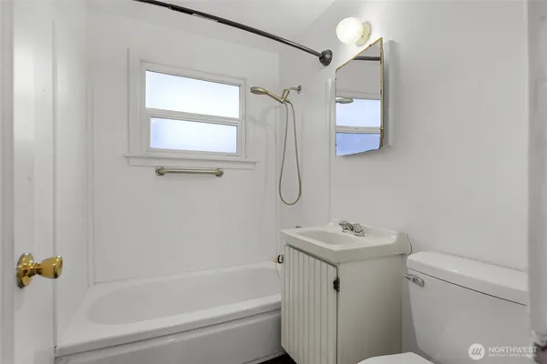 a bedroom with a bed and a potted plant