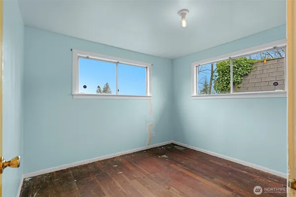 a bedroom with furniture and a window