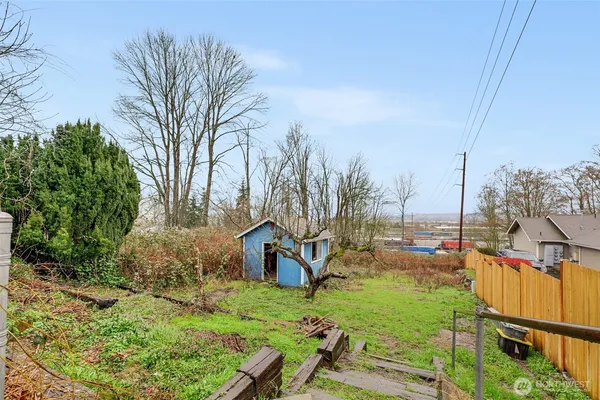 a front view of a house with a garden and plants