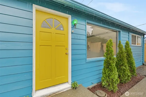 a living room with furniture and a table