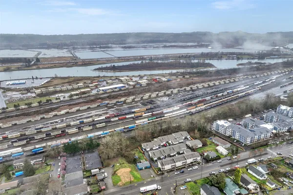an aerial view of residential houses with city view
