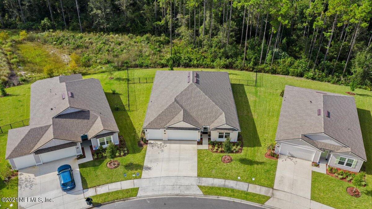 59 Rivertown Road Palm Coast, FL 32137 - Photo 3 of 30 an aerial view of a house with garden space and street view