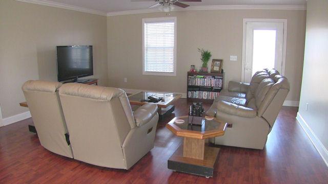 3704 Big Springs Road Lebanon, TN 37090 - Photo 2 of 20 a living room with furniture a flat screen tv and a window