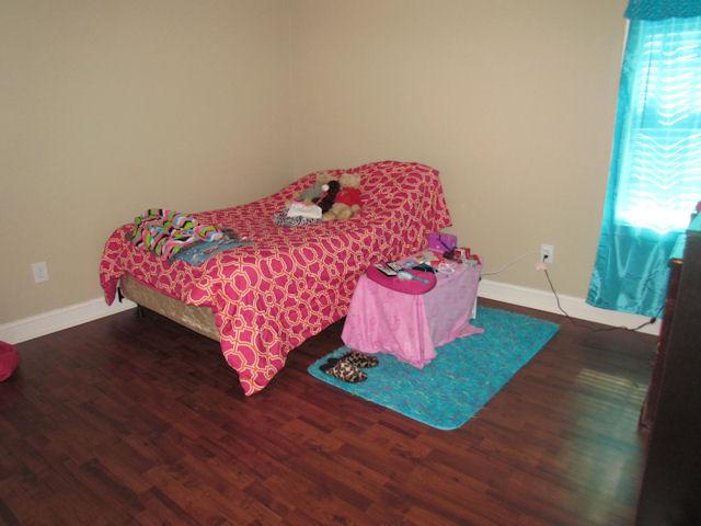 3704 Big Springs Road Lebanon, TN 37090 - Photo 8 of 20 a bed sitting in a bedroom next to a window