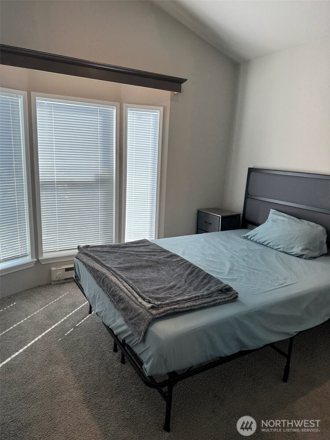 545 Hendricks Street, Unit 10A Port Townsend, WA 98368 - Photo 12 of 17 a bedroom with a bed and window