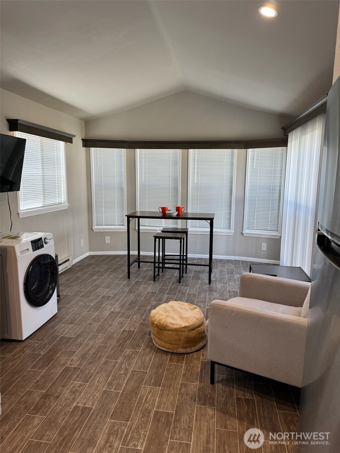 545 Hendricks Street, Unit 10A Port Townsend, WA 98368 - Photo 3 of 17 a living room with furniture and a fireplace