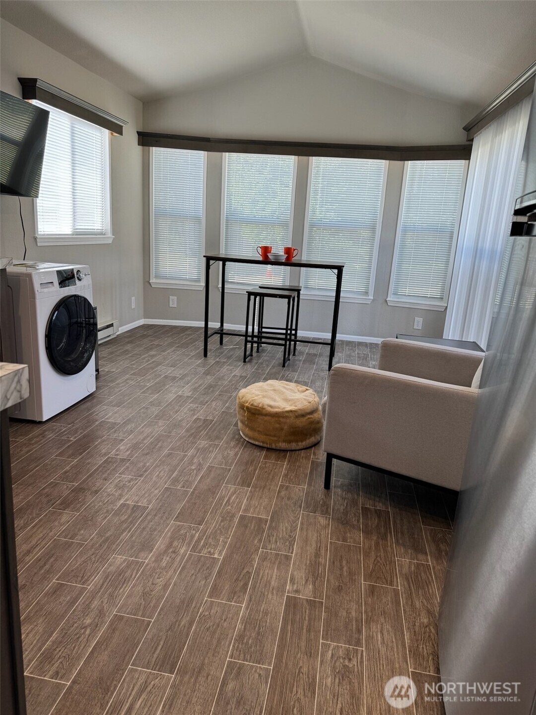 545 Hendricks Street, Unit 10A Port Townsend, WA 98368 - Photo 5 of 17 a living room with furniture and a window