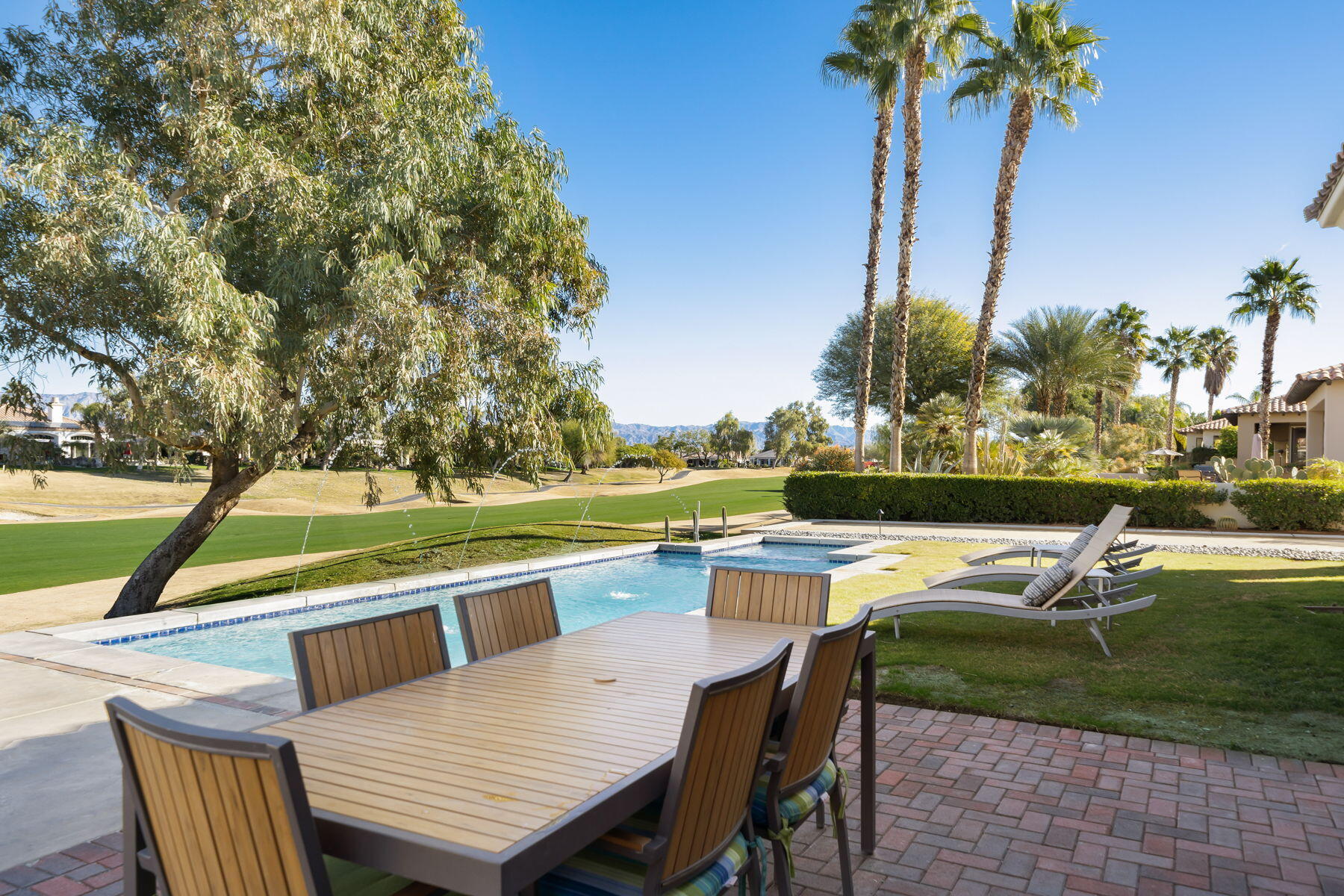 253 Loch Lomond Road Rancho Mirage, CA 92270 - Photo 15 of 66 a view of a patio with swimming pool