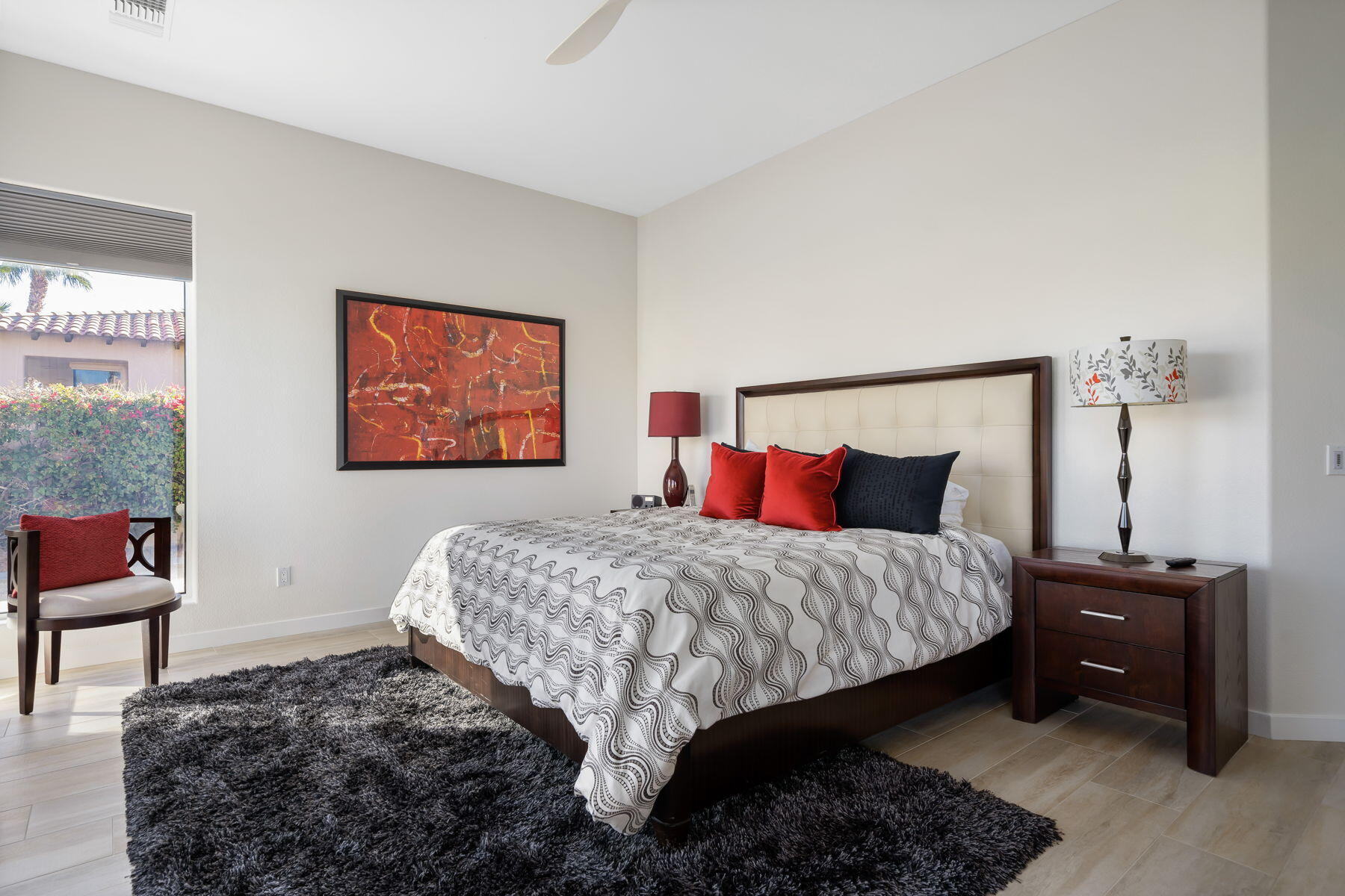 253 Loch Lomond Road Rancho Mirage, CA 92270 - Photo 18 of 66 a bedroom with a bed dresser and a two windows