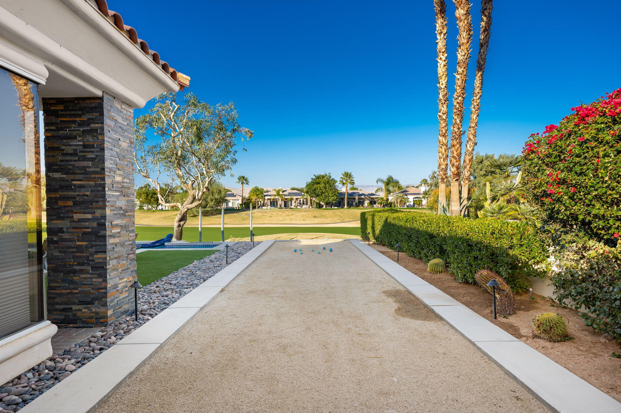 253 Loch Lomond Road Rancho Mirage, CA 92270 - Photo 2 of 66 a view of a garden