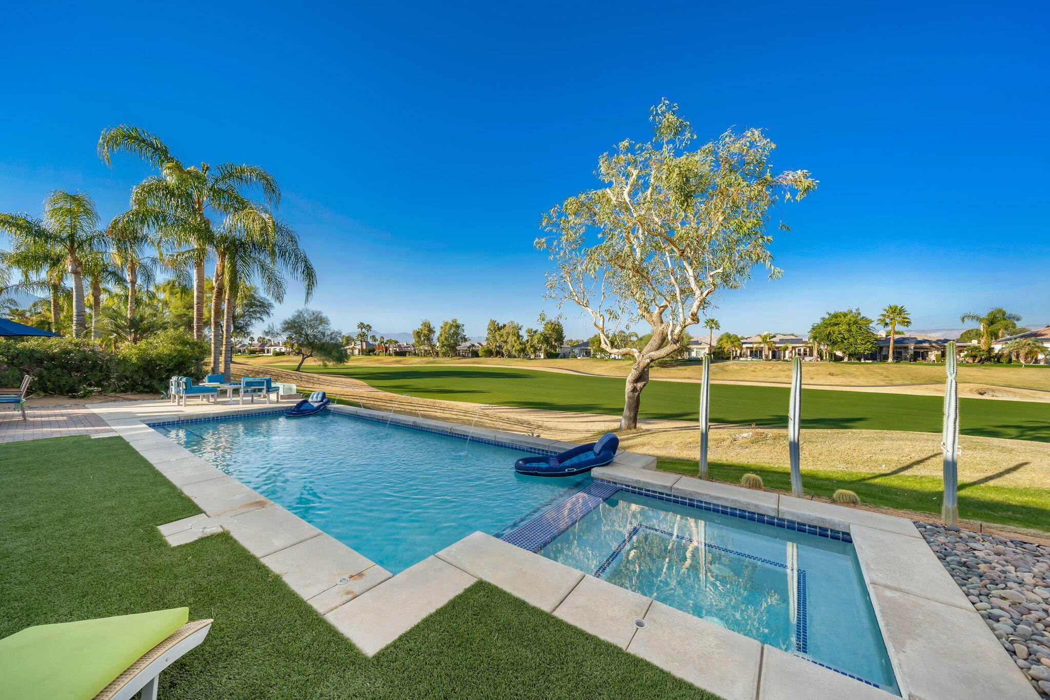 253 Loch Lomond Road Rancho Mirage, CA 92270 - Photo 34 of 66 a view of a backyard with swimming pool