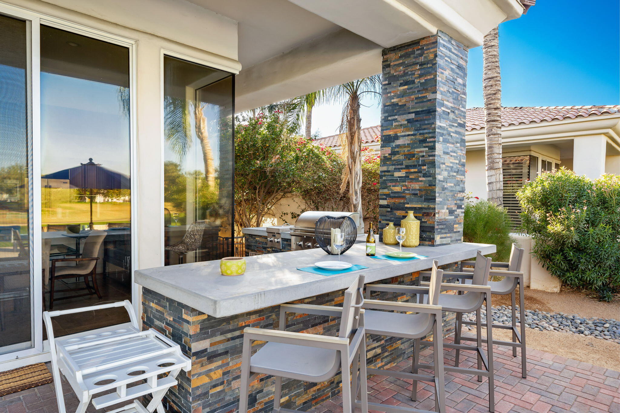 253 Loch Lomond Road Rancho Mirage, CA 92270 - Photo 38 of 66 a view of a patio with a table and chairs