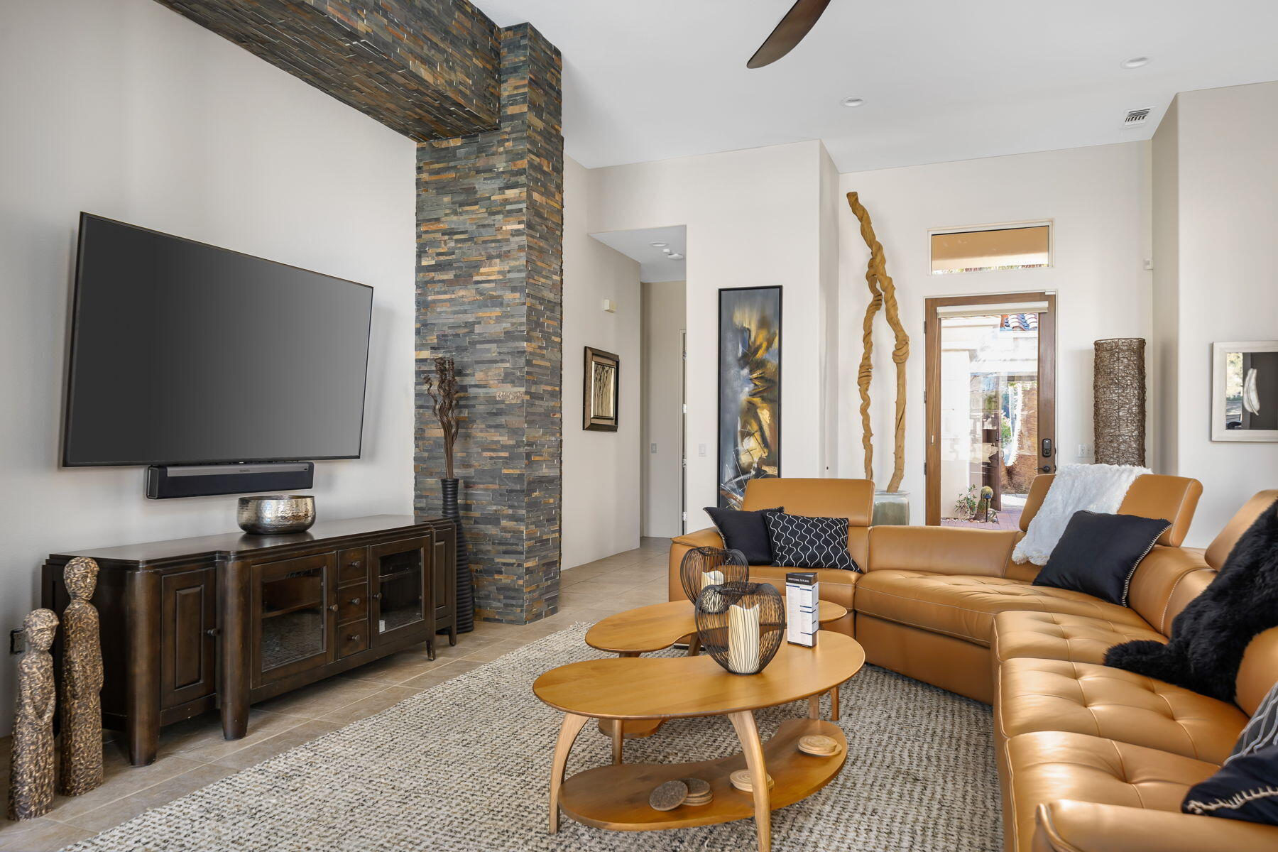 253 Loch Lomond Road Rancho Mirage, CA 92270 - Photo 4 of 66 a living room with furniture and a flat screen tv