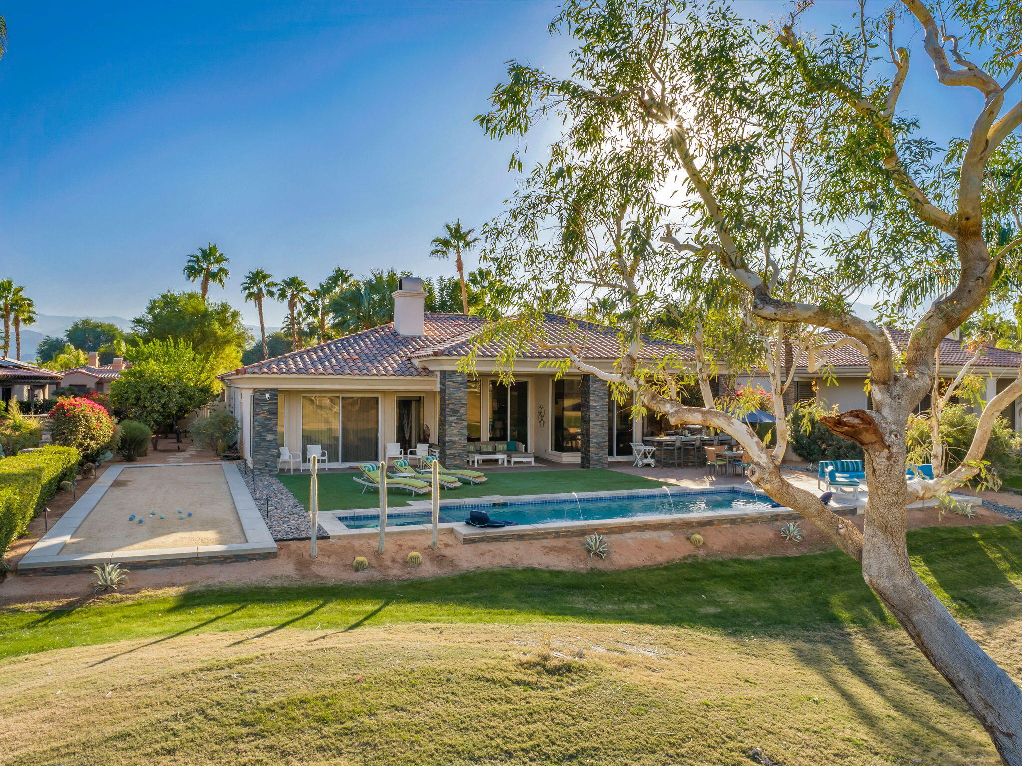 253 Loch Lomond Road Rancho Mirage, CA 92270 - Photo 66 of 66 a view of a house with a yard patio and swimming pool