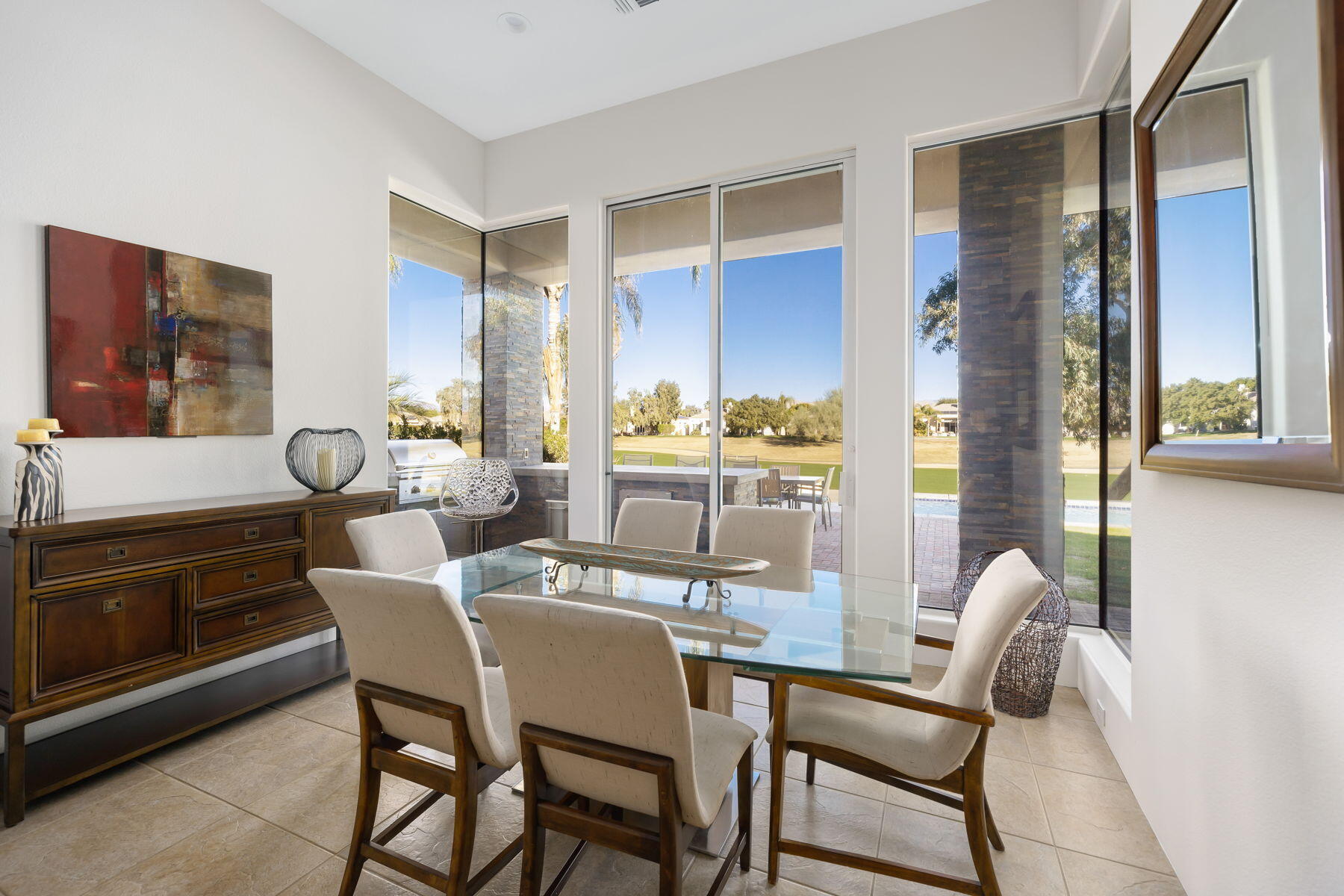 253 Loch Lomond Road Rancho Mirage, CA 92270 - Photo 8 of 66 a dining room with furniture and wooden floor