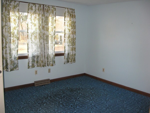 657 Amostown Road West Springfield, MA 01089 - Photo 15 of 29 a view of an empty room with wooden floor and a window