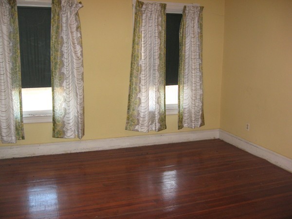 657 Amostown Road West Springfield, MA 01089 - Photo 16 of 29 a view of an empty room with wooden floor and a window