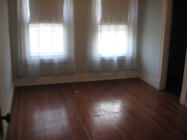 657 Amostown Road West Springfield, MA 01089 - Photo 17 of 29 an empty room with wooden floor and windows