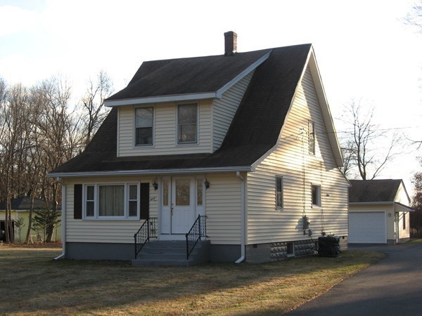 657 Amostown Road West Springfield, MA 01089 - Photo 2 of 29 a front view of a house with a balcony