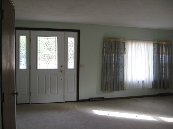 657 Amostown Road West Springfield, MA 01089 - Photo 5 of 29 an empty room with wooden floor and windows