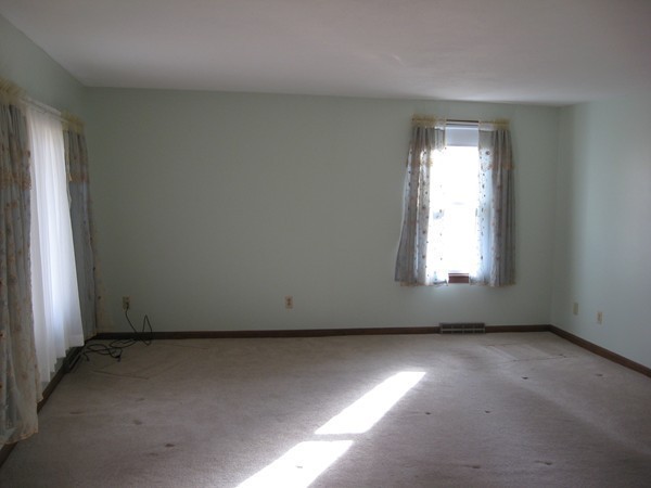 657 Amostown Road West Springfield, MA 01089 - Photo 7 of 29 an empty room with a window