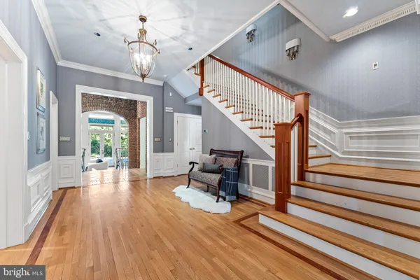 a kitchen with stainless steel appliances granite countertop wooden cabinets a stove top oven a sink and dishwasher