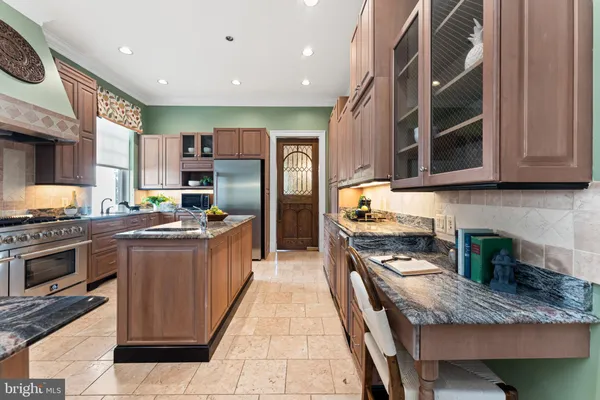 a living room with furniture a table and a large window