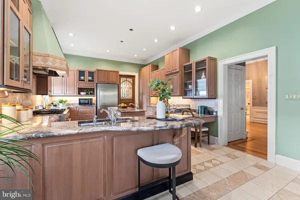 a spacious bedroom with a bed and wooden floor
