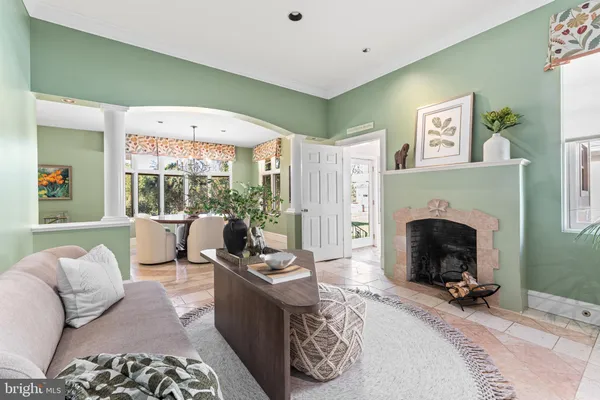 a bath tub sitting in a bathroom next to a window