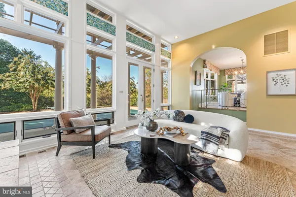 a spacious bathroom with a granite countertop sink and a mirror