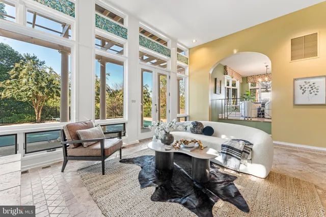 a spacious bathroom with a granite countertop sink and a mirror