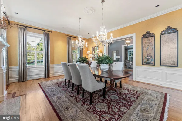a living room with furniture large window and fireplace