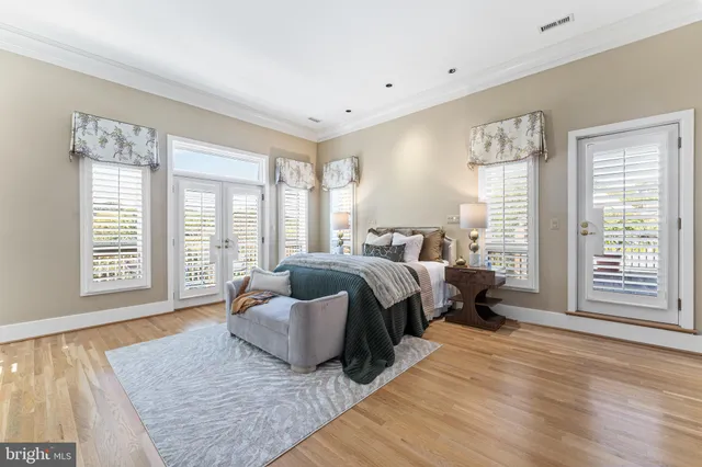an aerial view of lake and residential houses with outdoor space