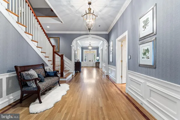 a kitchen with stainless steel appliances granite countertop a stove top oven a sink dishwasher and cabinets with wooden floor