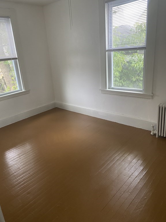 19 Meacham Street, Unit 1 Somerville, MA 02145 - Photo 8 of 11 an empty room with a window