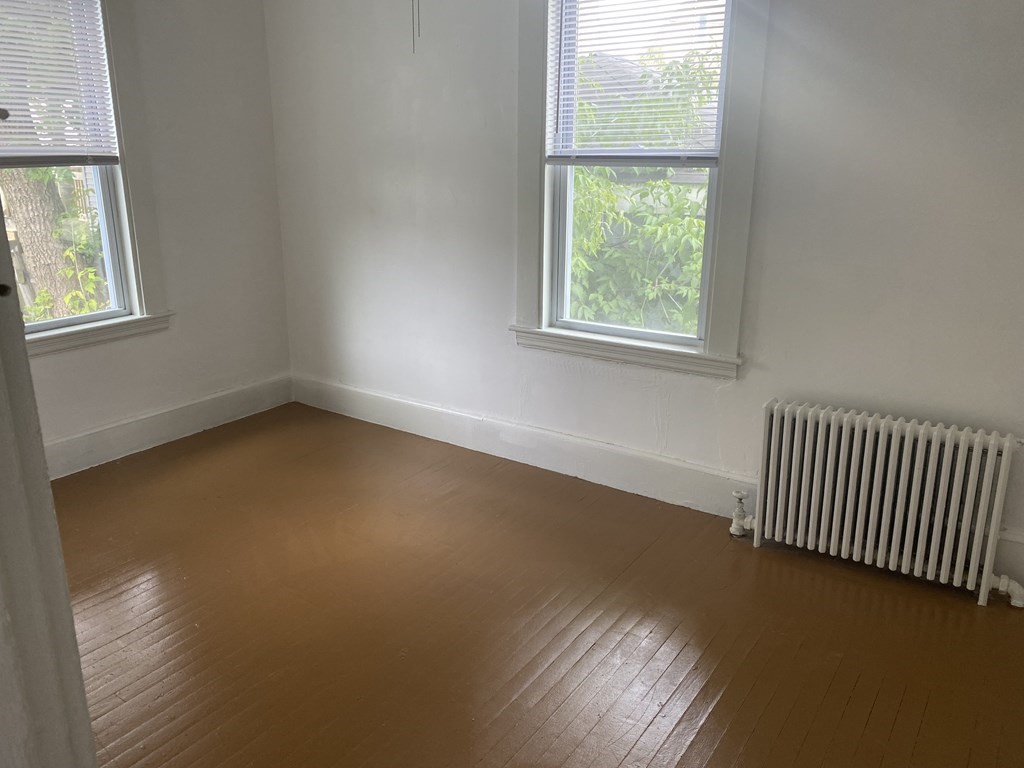 19 Meacham Street, Unit 1 Somerville, MA 02145 - Photo 9 of 11 a view of empty room with window