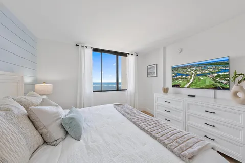 a bedroom with a bed and a dresser