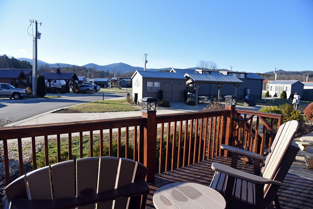 52 Foggy Mountain Road Blairsville, GA 30512 - Photo 13 of 50 a view of a balcony with wooden chairs