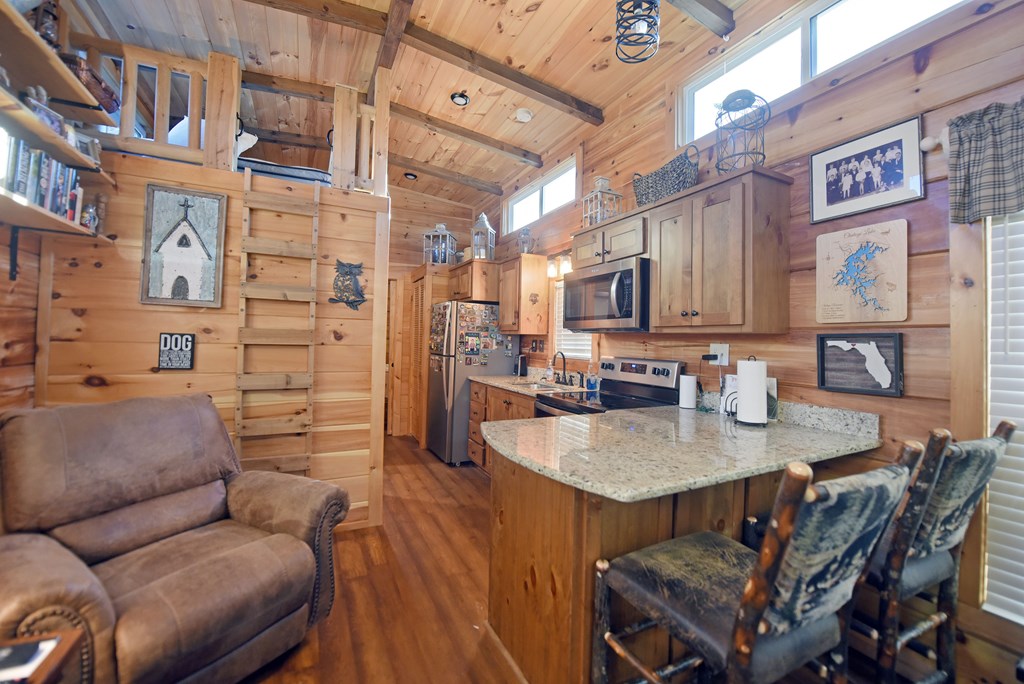 52 Foggy Mountain Road Blairsville, GA 30512 - Photo 15 of 50 a view of kitchen and kitchen with granite countertop a couch