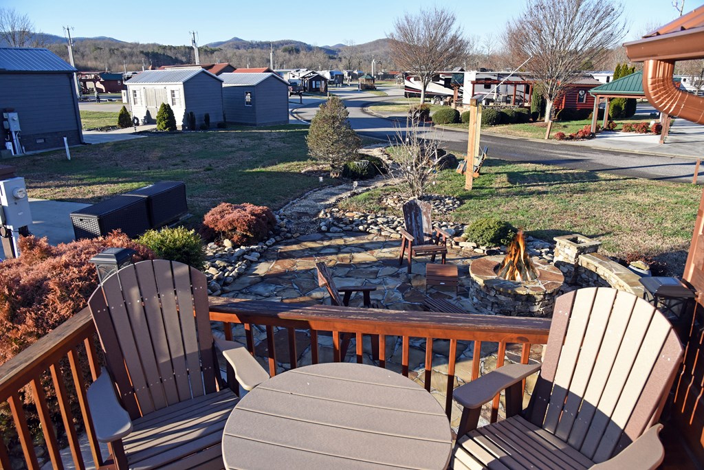 52 Foggy Mountain Road Blairsville, GA 30512 - Photo 2 of 50 a view of a chairs and table on the deck