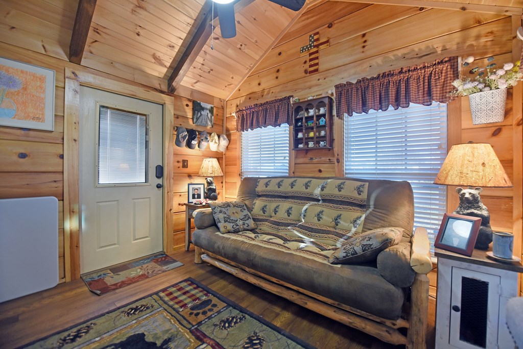 52 Foggy Mountain Road Blairsville, GA 30512 - Photo 23 of 50 a bedroom with furniture and a lamp