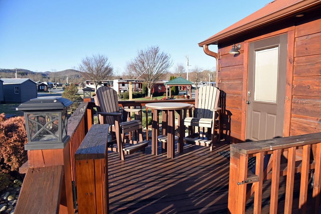 52 Foggy Mountain Road Blairsville, GA 30512 - Photo 27 of 50 a view of a balcony with wooden floor outdoor seating and city view