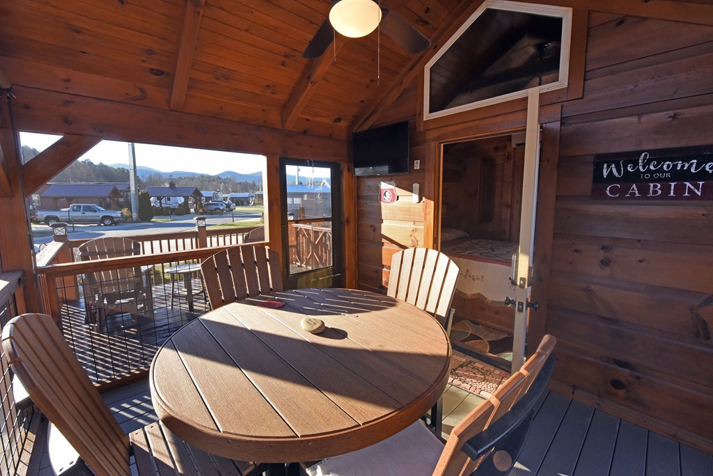 52 Foggy Mountain Road Blairsville, GA 30512 - Photo 7 of 50 a view of a balcony with a table and chairs