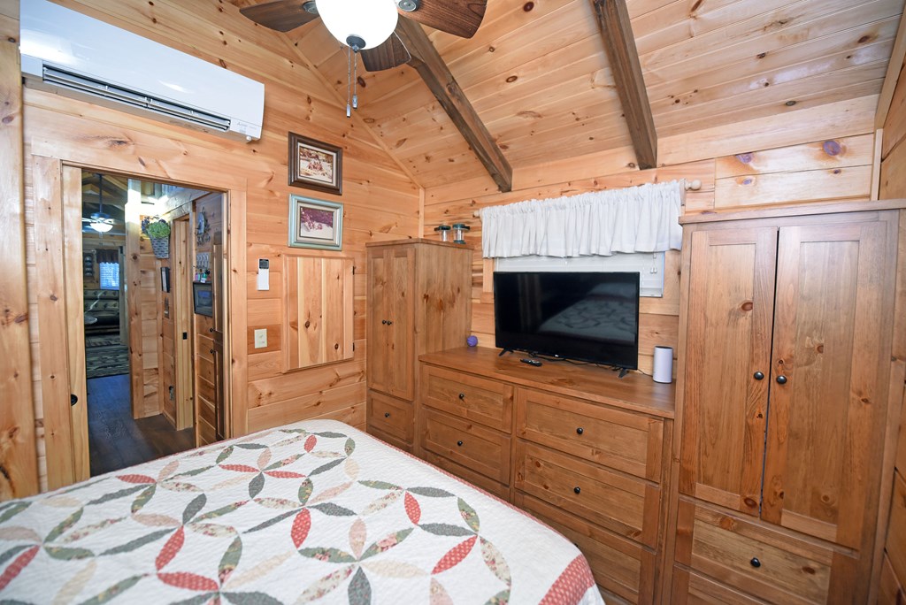 52 Foggy Mountain Road Blairsville, GA 30512 - Photo 9 of 50 a bedroom with a bed and a television