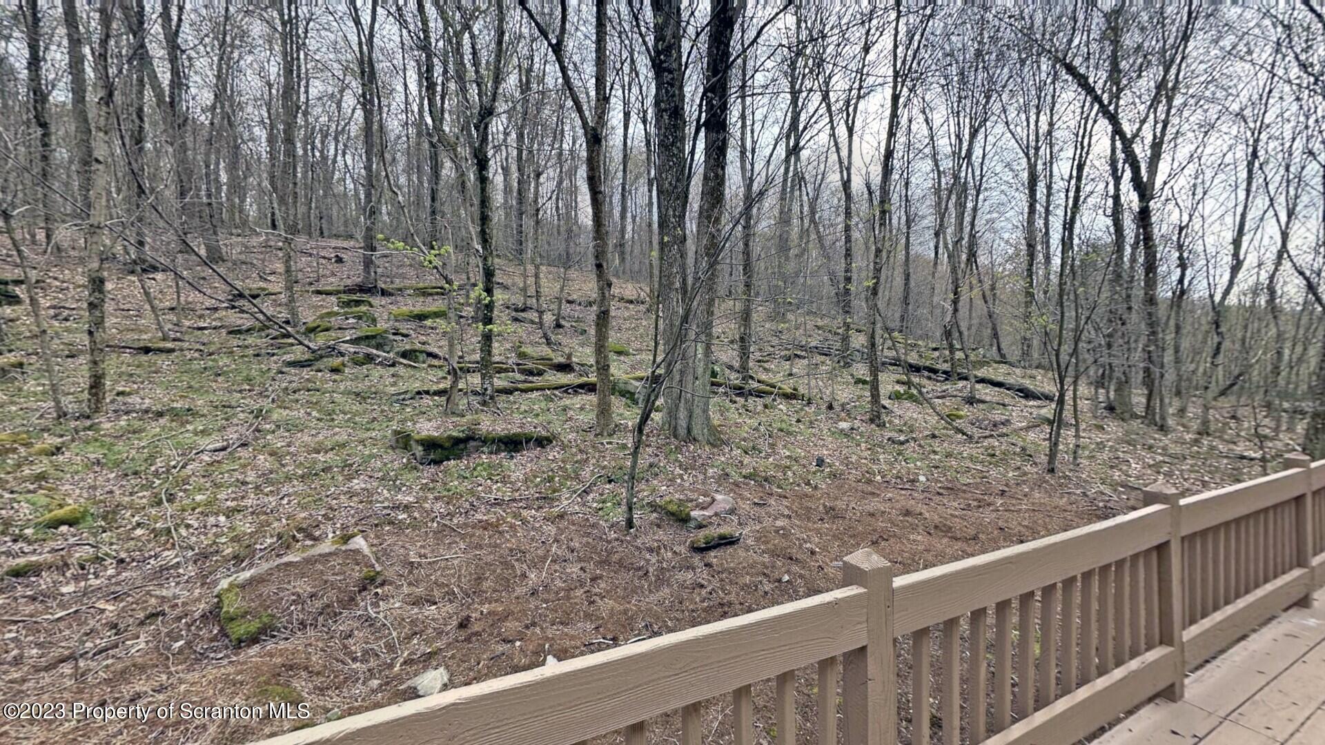 1013 Hemlock Way Newfoundland, PA 18445 - Photo 12 of 44 a view of a wooden fence with trees in the background