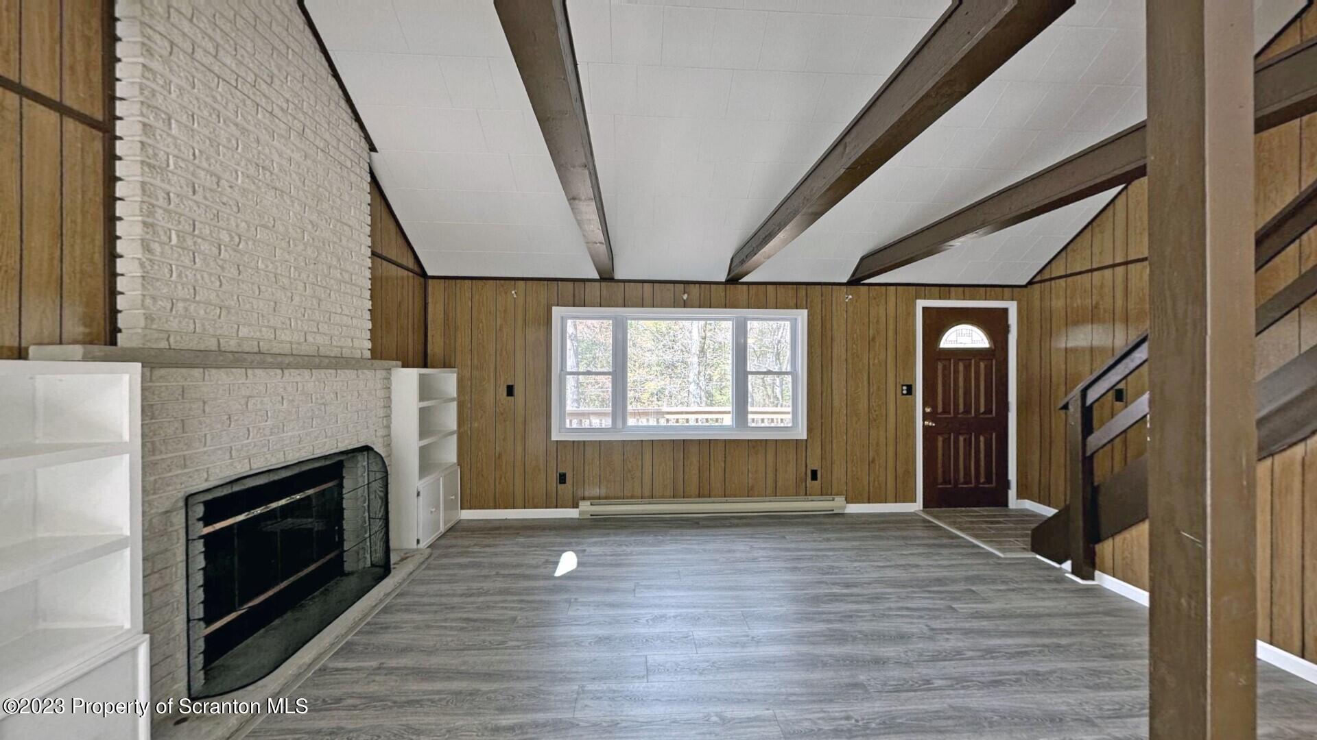 1013 Hemlock Way Newfoundland, PA 18445 - Photo 14 of 44 a view of empty room with wooden floor and fan