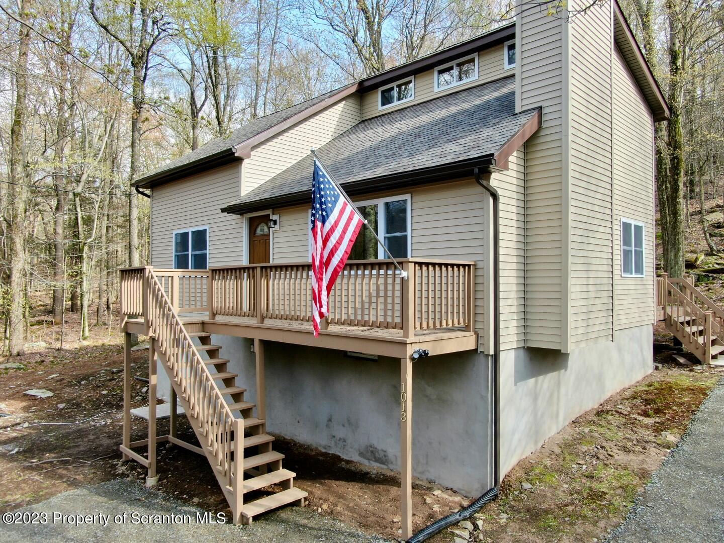 1013 Hemlock Way Newfoundland, PA 18445 - Photo 3 of 44 a small white building with a white roof and stairs