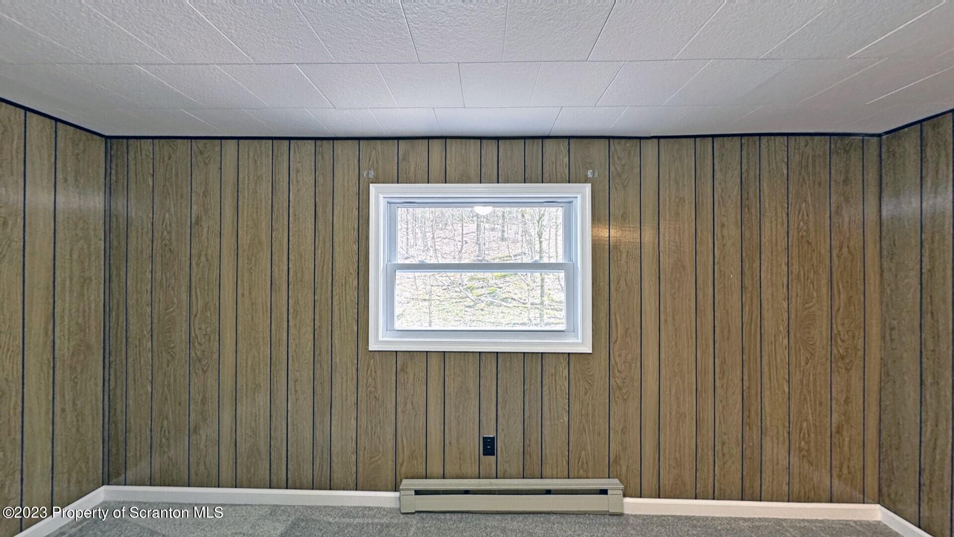 1013 Hemlock Way Newfoundland, PA 18445 - Photo 32 of 44 a view of a room with a window and a ceiling fan