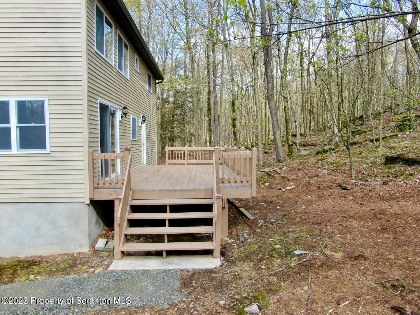 1013 Hemlock Way Newfoundland, PA 18445 - Photo 5 of 44 a view of a backyard with sitting area